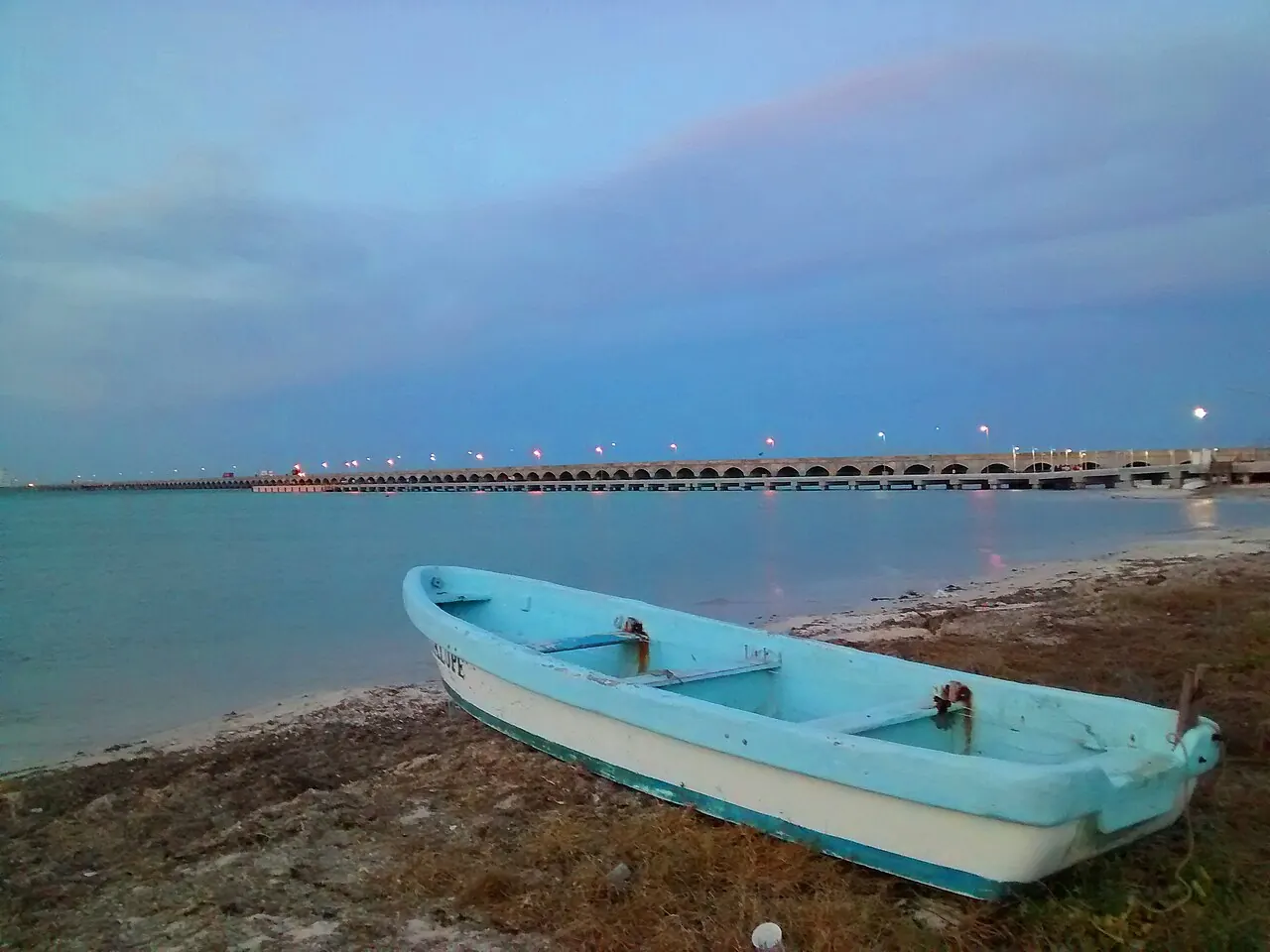 A fishing boat beside the long pier at Progreso, Yucatán